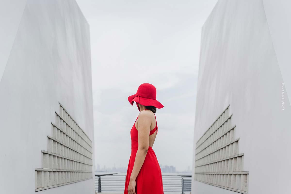 milan-fashion-week-alberta-ferretti-fashion-show-new-spring-summer-collection-woman-wearing-a-beautiful-long-red-dress-with-red-hat